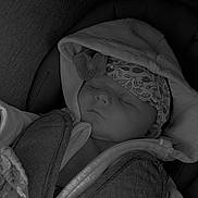 Georgina participe au concours pour gagner de l'argent avec cette photo : baby, sleeping, hood, headband, seat, blanket, clothing, infant, peaceful, child, portrait, closeup, cozy, resting, cute, indoors, soft, warm, face, toddler