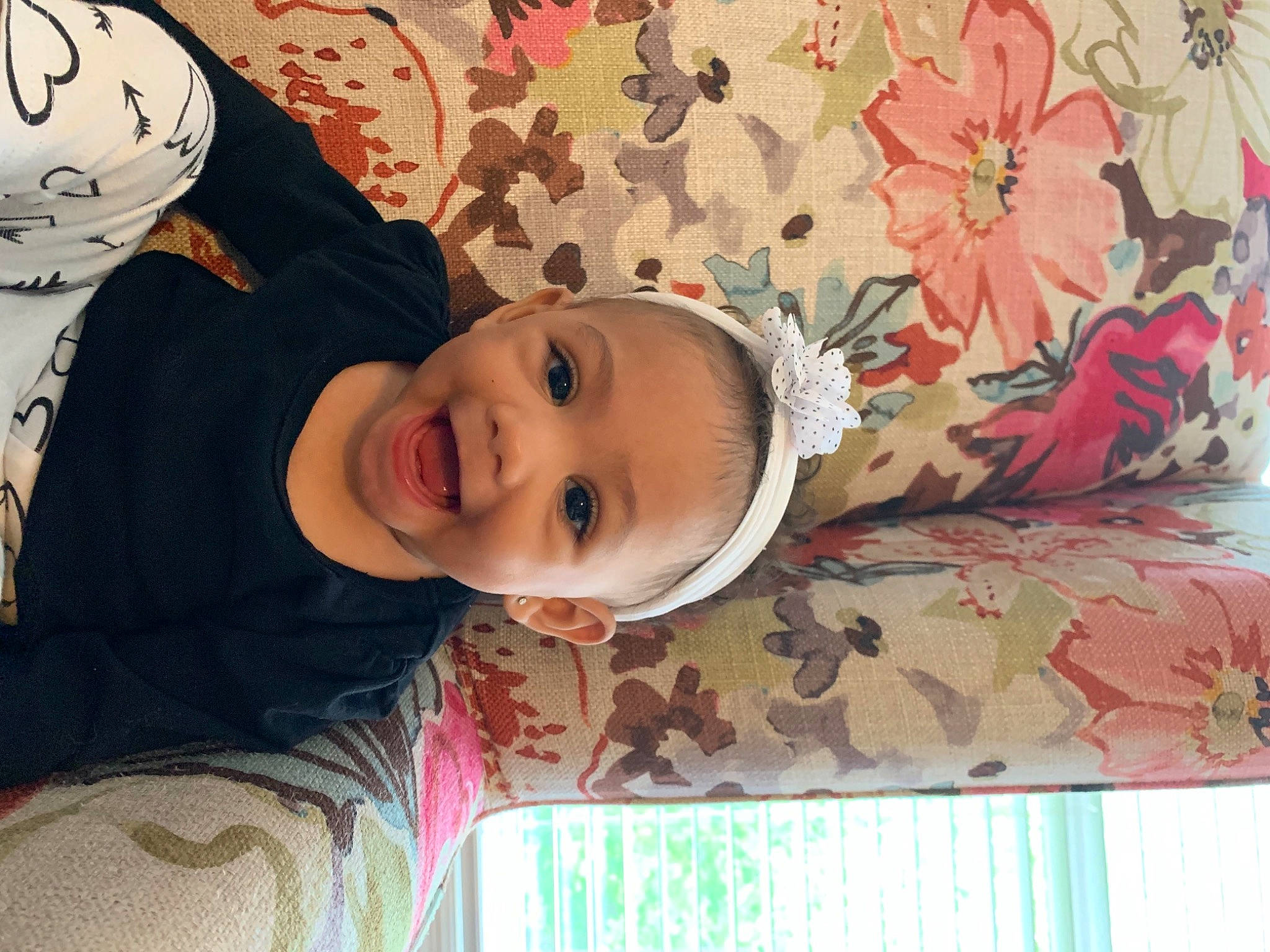 Jada is registered to the contest to win money with this photo: baby, beauty, cheek, child, chin, eye, face, fun, happy, head, leaf, lip, nose, person, pink, plant, skin, smile, textile, toddler