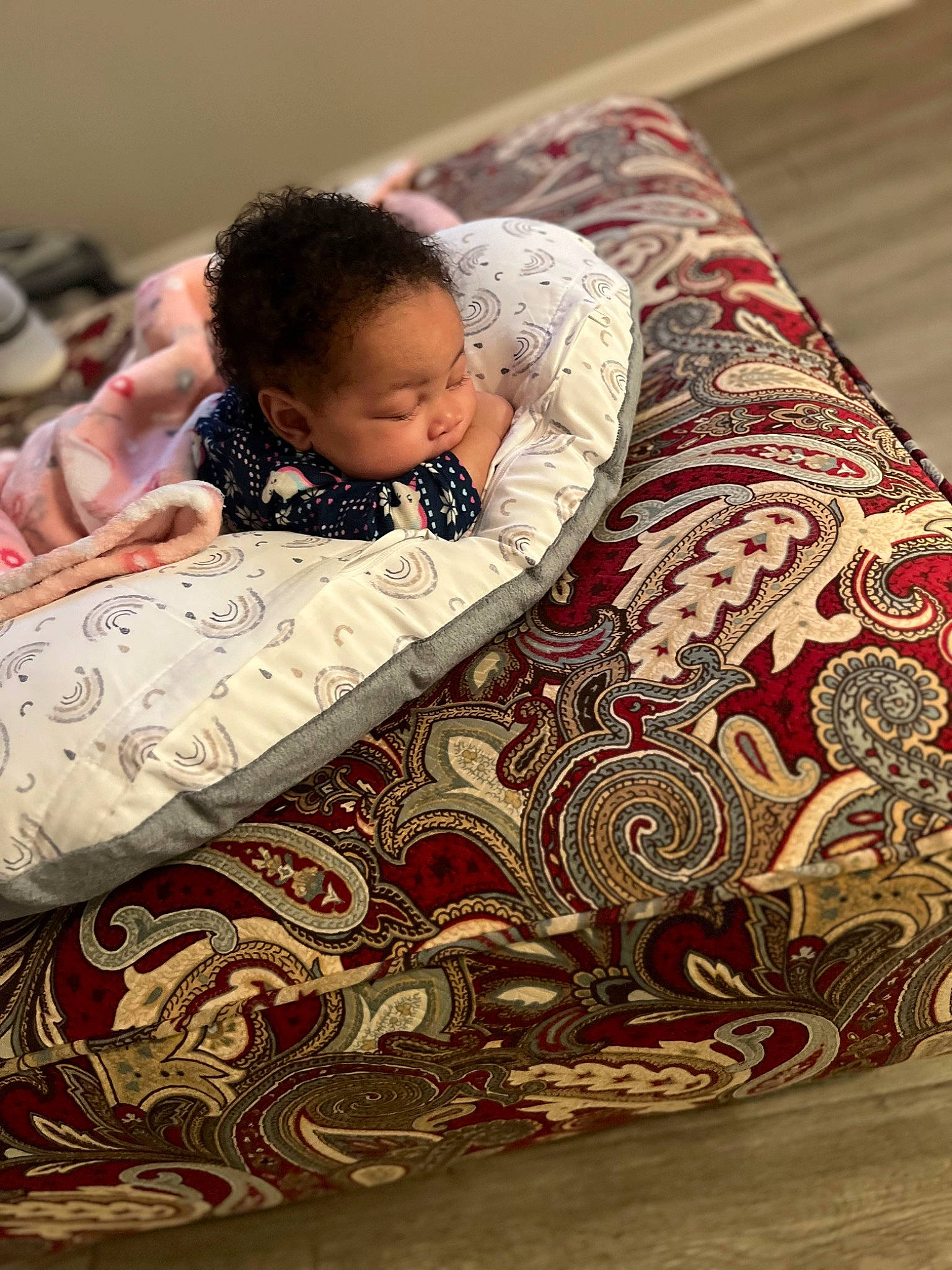 Clover is registered to the contest to win money with this photo: art, baby, bed_sheet, bedding, bedroom, bedtime, carmine, child, comfort, flooring, happy, linens, nap, pattern, person, reading, room, sitting, textile, toddler