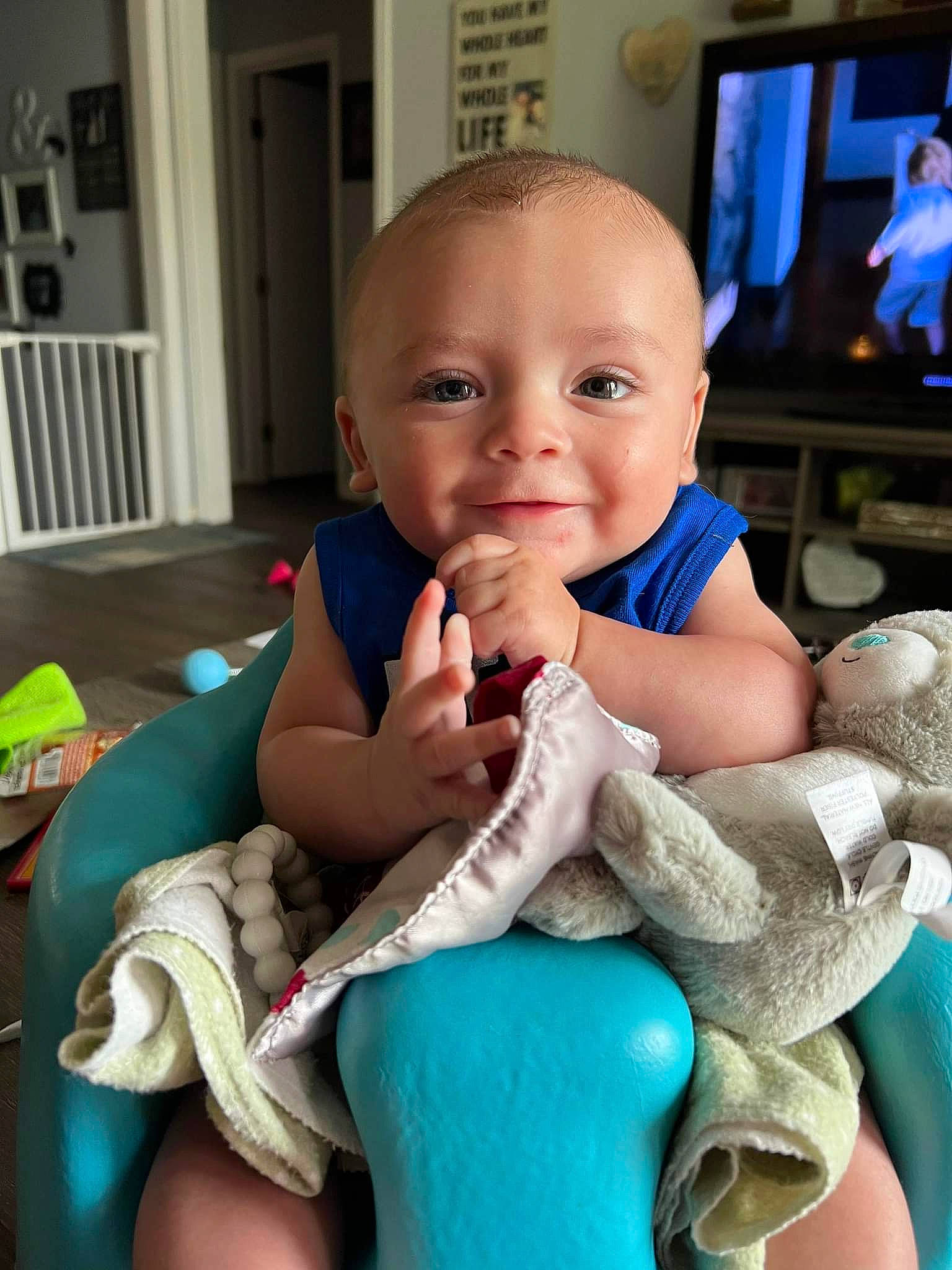 Chance is registered to the contest to win money with this photo: azure, baby, baby_toddler_clothing, cheek, child, comfort, door, electric_blue, finger, gesture, happy, head, mouth, nail, person, sitting, skin, smile, television, thumb