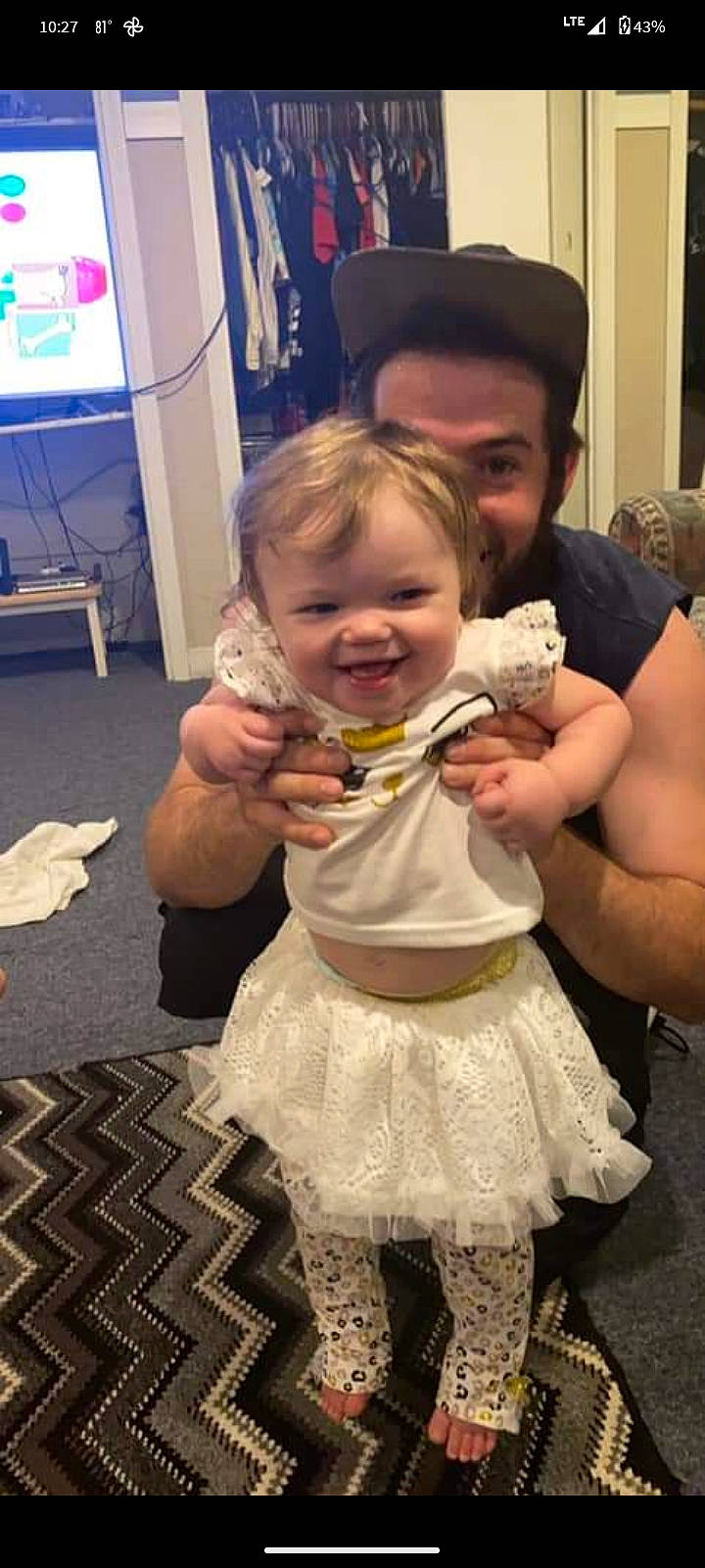 Nevaeh joined the competition — help win amazing prizes! arm, baby, child, dress, event, finger, flooring, formal_wear, fun, gesture, hair, hand, happy, joy, leg, person, sitting, skin, smile, television