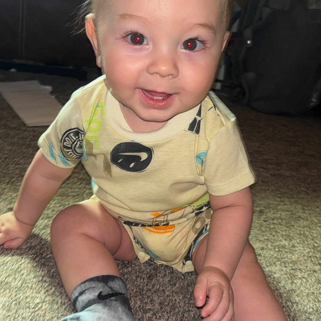 Kingston joined the competition — help win amazing prizes! baby, blond_hair, candid, carpet, child, cute, face, footwear, hand, happy, indoor, infant, onesie, person, portrait, red_eye, sitting, smiling, socks, young_child