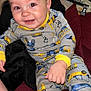 Kingston joined the competition — help win amazing prizes! baby, child, smiling, pajamas, construction_theme, indoor, couch, blanket, hand, face, person, clothing, happy, infant, cute, sitting, soft_texture, home, comfort, toy