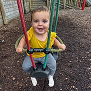 Ella joined the competition — help win amazing prizes! toddler, child, swing, playground, smiling, yellow_clothing, rope, wooden_fence, slide, outdoor, play, happy, park, seat, fun, daylight, person, feet, ground, woodchips