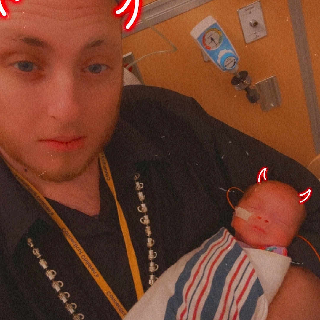 Clover is registered to the contest to win money with this photo: accessories, architecture, baby, bodypart, building, clothing, face, finger, furniture, glasses, glove, head, hospital, jewelry, necklace, newborn, person, photography, portrait, t_shirt