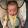Jayden a rejoint le concours — aidez-le/la à gagner de superbes lots ! baby, baby_seat, child, clothing, comfort, cushion, cute, expression, eyes, face, hair, indoors, infant, portrait, seat, sitting, sock, soft, straps, yellow_onesie