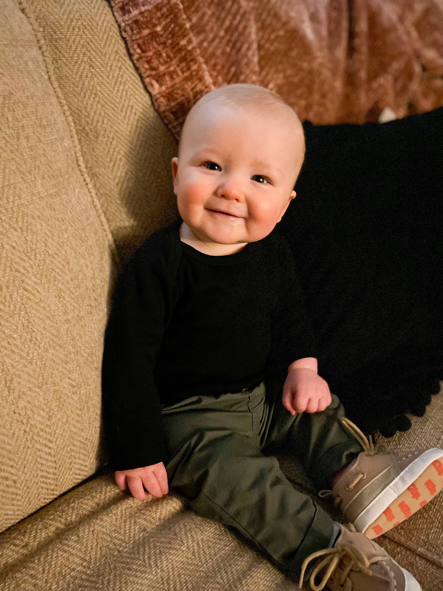 Carter joined the competition — help win amazing prizes! baby, baby_toddler_clothing, cheek, child, chin, comfort, couch, floor, flooring, foot, fun, happy, human_body, joy, leg, person, sitting, skin, sleeve, smile