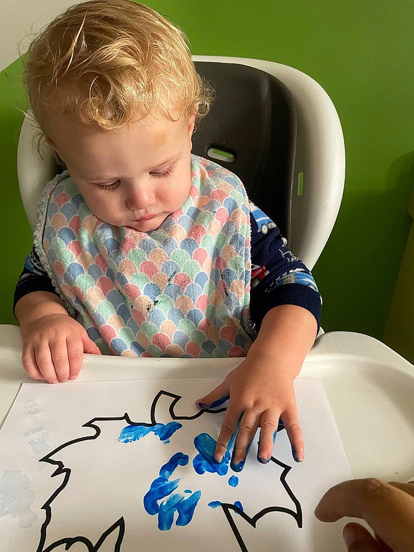 Robby is registered to the contest to win money with this photo: art, child, cool, finger, font, fun, hand, handwriting, happy, homework, human, mouth, nail, pattern, person, plaid, sleeve, t_shirt, textile, toddler