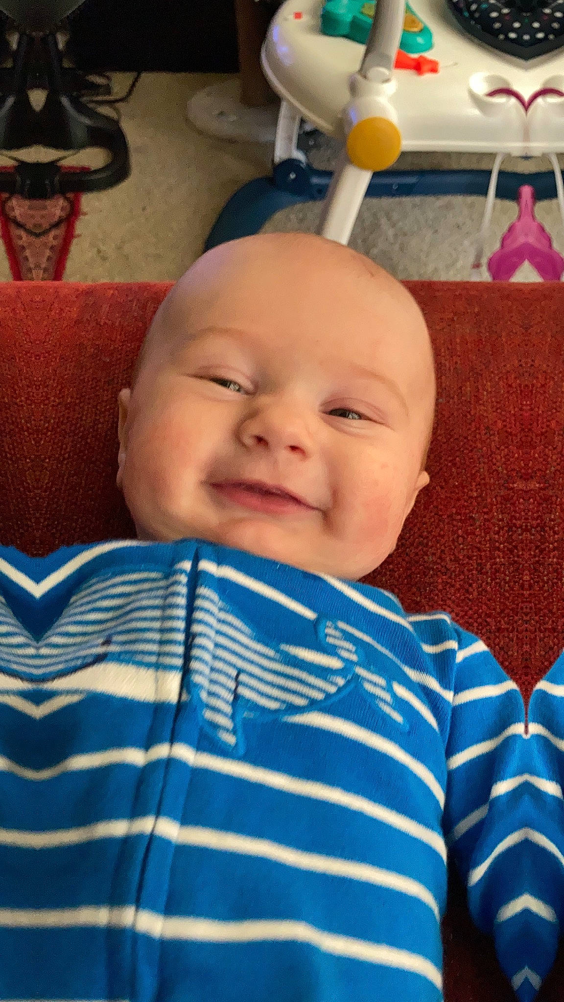 Leonardo is registered to the contest to win money with this photo: baby, baby_toddler_clothing, blue, cheek, child, comfort, electric_blue, facial_expression, fun, happy, light, linens, pattern, person, room, skin, smile, t_shirt, textile, toddler