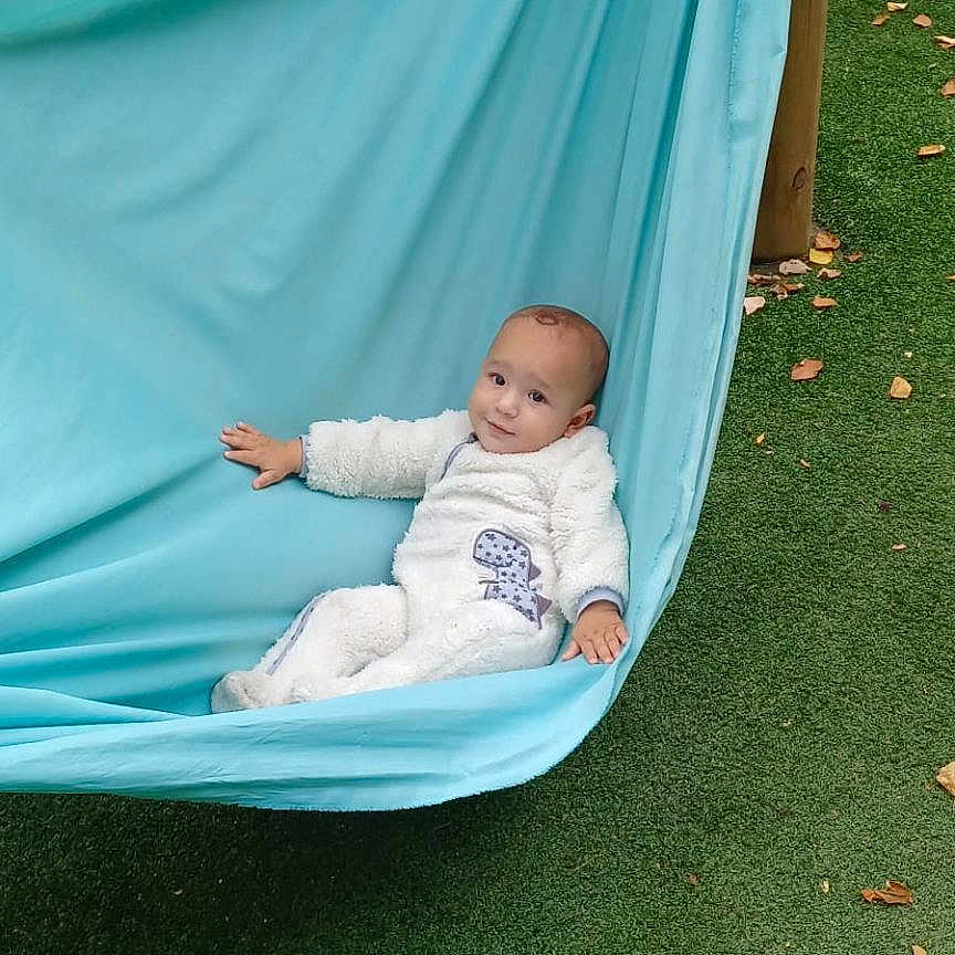 Ryan is registered to the contest to win money with this photo: architecture, baby, backyard, building, face, furniture, grass, hammock, head, nature, outdoorplayarea, outdoors, person, photography, plant, playarea, portrait, shelter, sleeping, yard