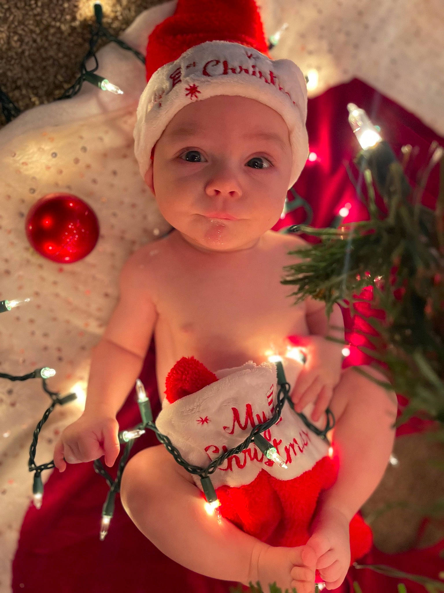 Marcus joined the competition — help win amazing prizes! baby, baby_toddler_clothing, cap, christmas, christmas_decoration, christmas_eve, christmas_ornament, costume_hat, event, fictional_character, happy, head, headwear, holiday, holiday_ornament, human_body, ornament, party_supply, person, pink