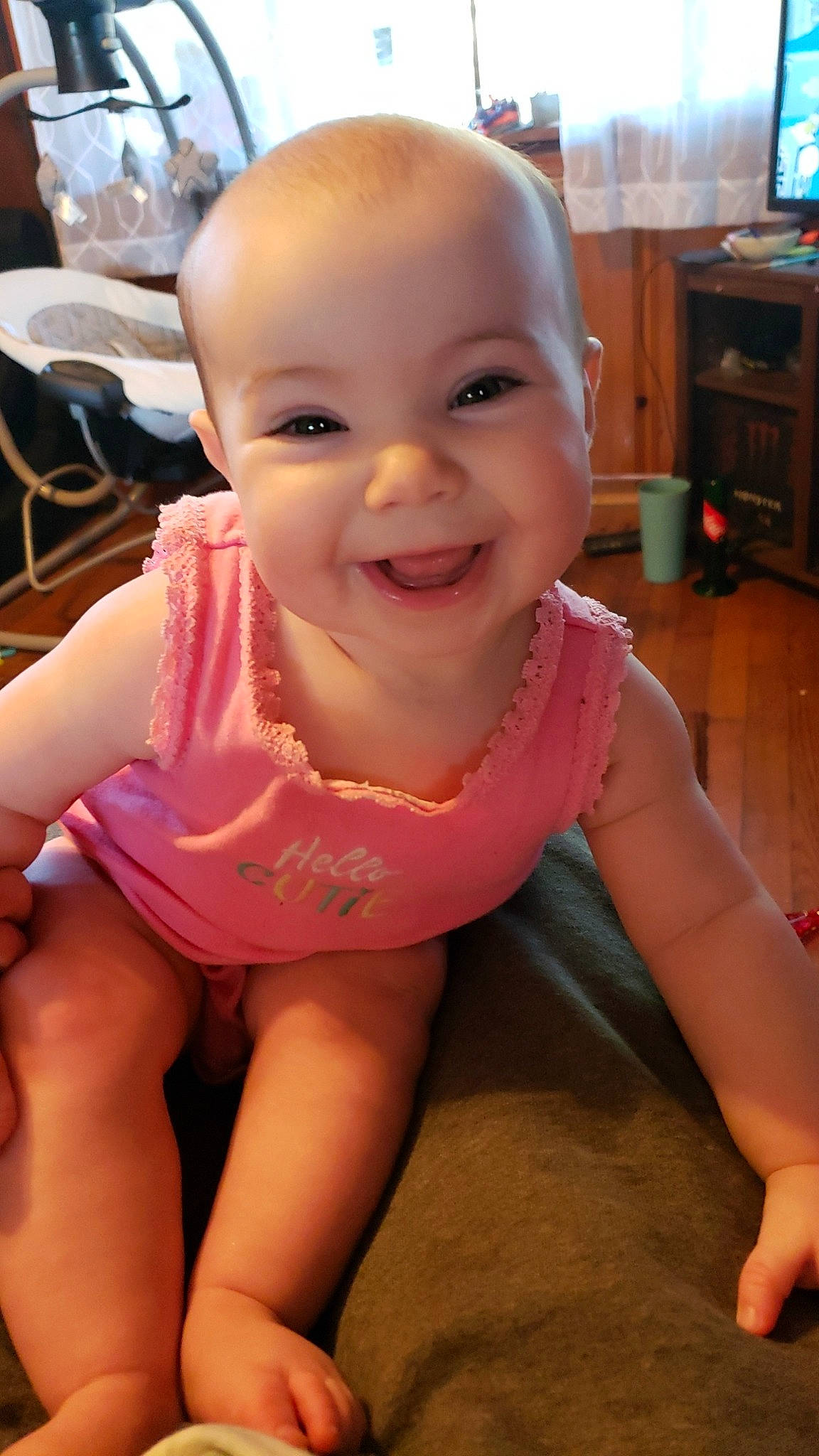Elizabeth is registered to the contest to win money with this photo: baby, baby_toddler_clothing, cabinetry, cheek, chest, child, face, finger, fun, happy, joy, lip, mouth, nose, person, pink, skin, smile, television, thigh