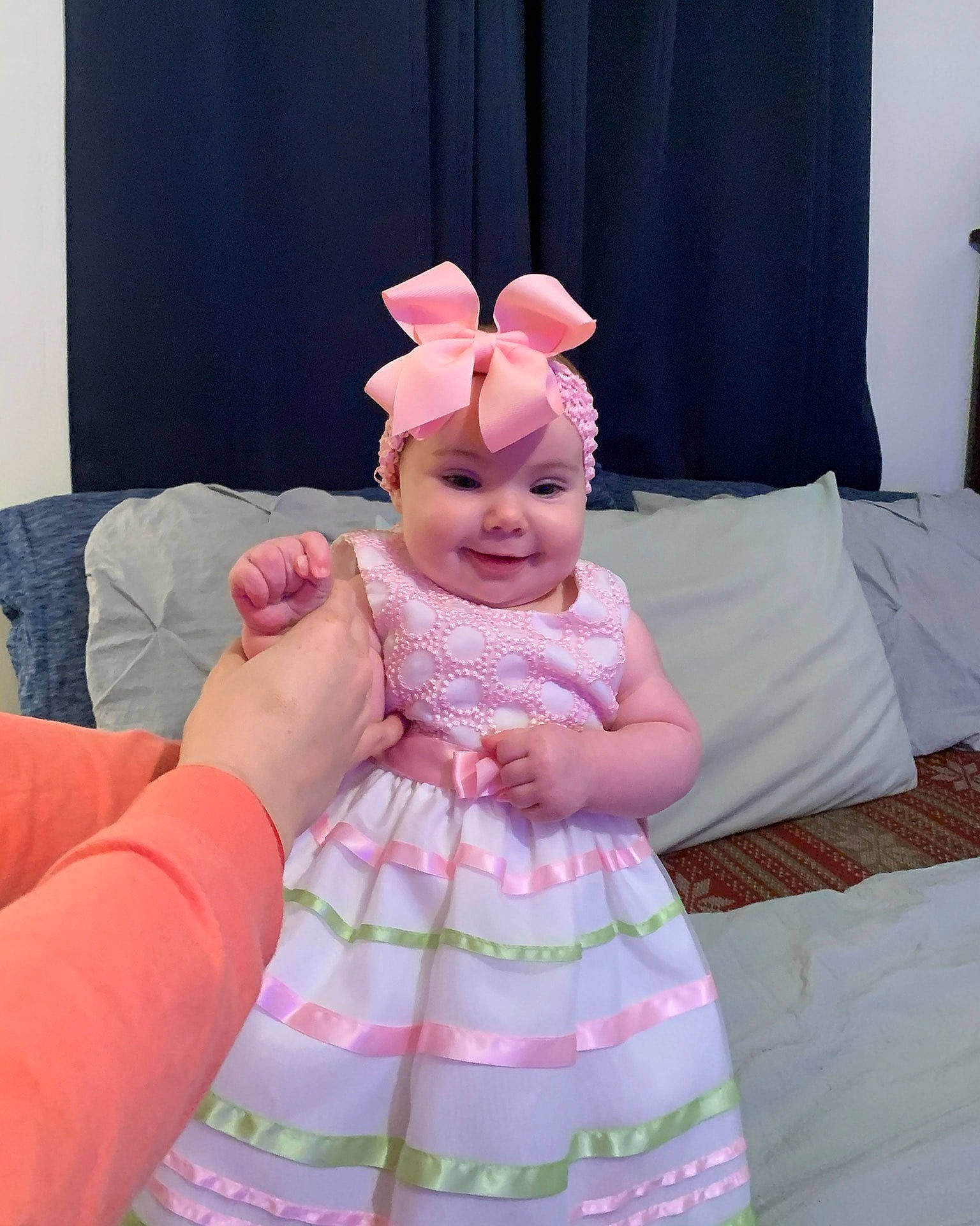 Elizabeth is registered to the contest to win money with this photo: arm, baby, baby_toddler_clothing, beauty, dress, finger, gesture, hand, happy, headband, headwear, human_body, joy, magenta, person, pink, purple, skin, sleeve, smile