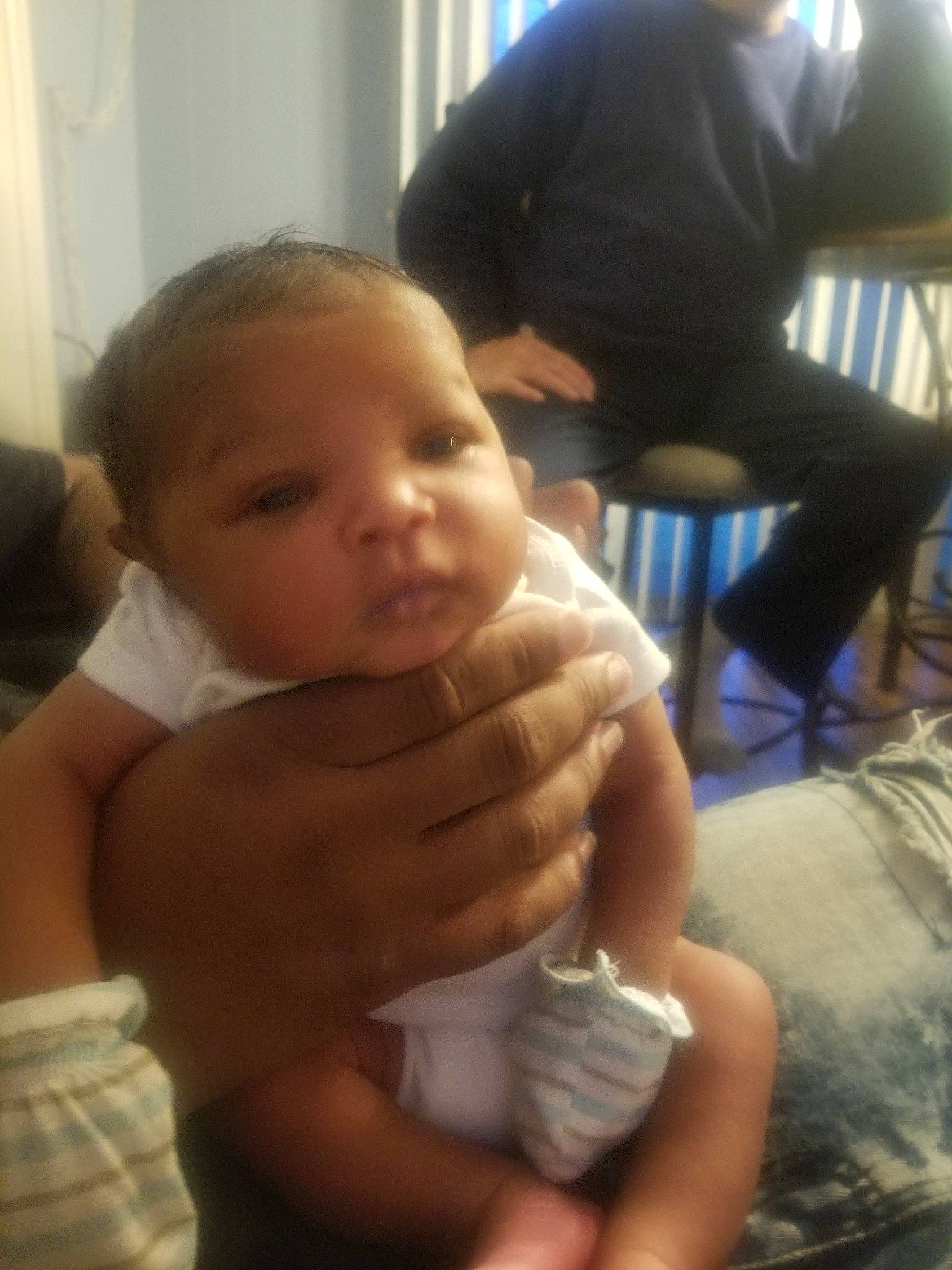 Naseer is registered to the contest to win money with this photo: baby, cheek, child, electronic_device, face, finger, hand, head, mouth, muscle, nose, person, skin, smile, thumb, toddler, vacation