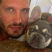 Mik joined the competition — help win amazing prizes! man, dog, french_bulldog, tattoo, blue_eyes, beard, closeup, portrait, pet, cuddle, indoor, bed, white_bedding, muscle, animal, face, expression, looking_at_camera, human, friendship