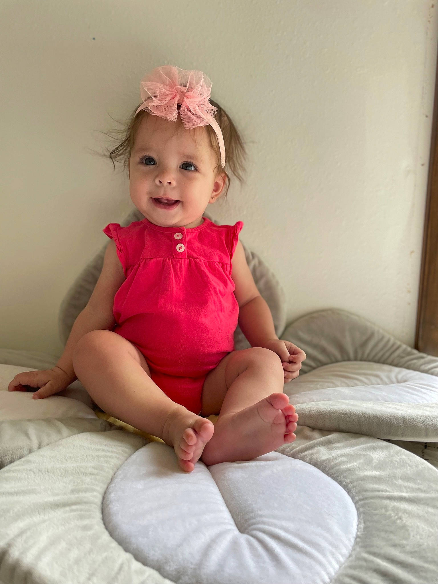 Braelynn is registered to the contest to win money with this photo: arm, baby_toddler_clothing, clothing, comfort, dress, eye, face, facial_expression, finger, hair, head, human_body, joy, knee, neck, person, pink, skin, sleeve, smile