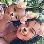 Genesis is registered to the contest to win money with this photo: baby, woman, selfie, outdoor, park, trees, sunlight, smile, face_filter, dog_ears, dog_nose, pink_bows, curly_hair, happy, child, nature, greenery, necklace, closeup, family
