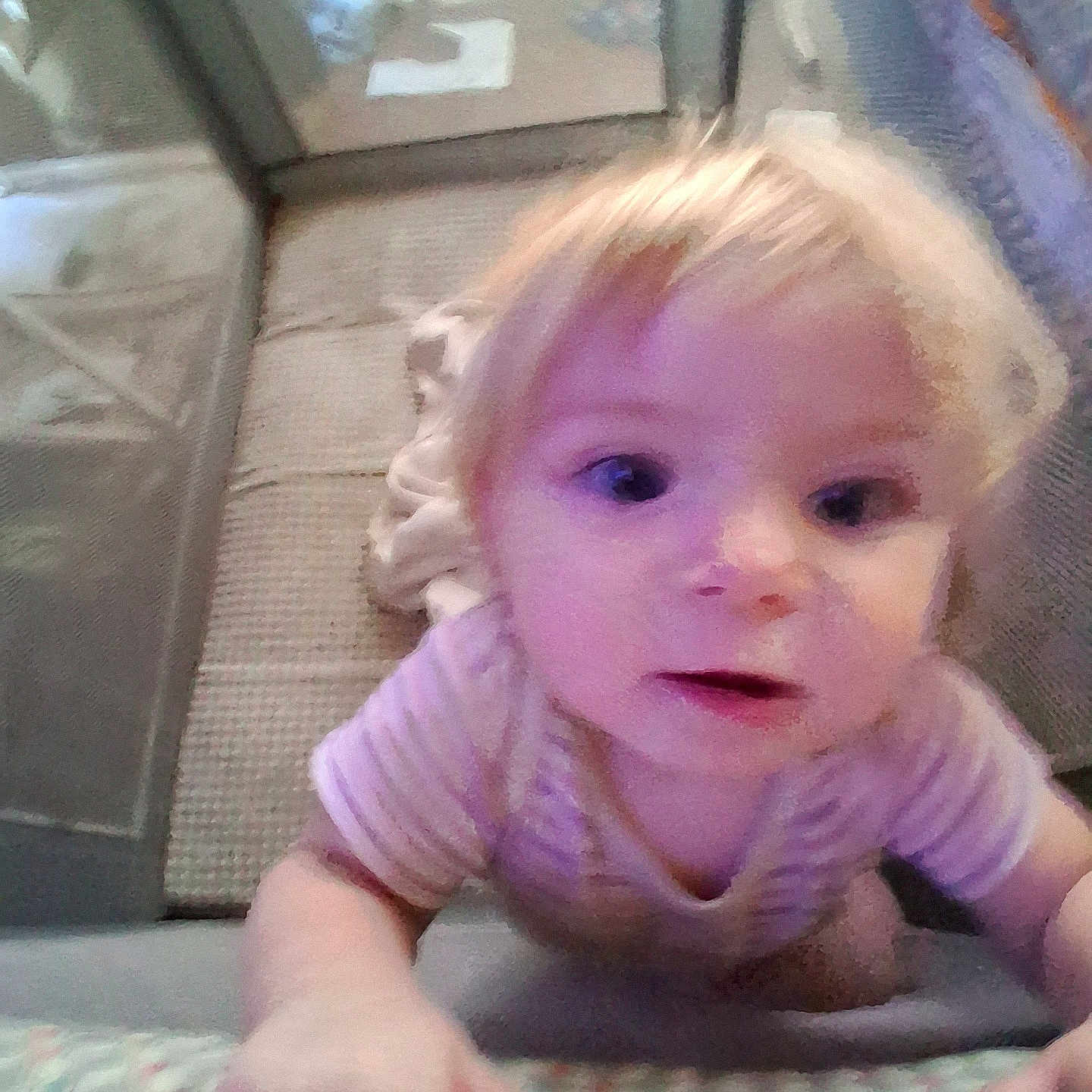 Winter is registered to the contest to win money with this photo: toddler, child, blonde_hair, playpen, indoor, curious, baby, grip, soft_light, blur, person, infant, young_child, candid, close_up, face, hands, striped_clothing, home, floor