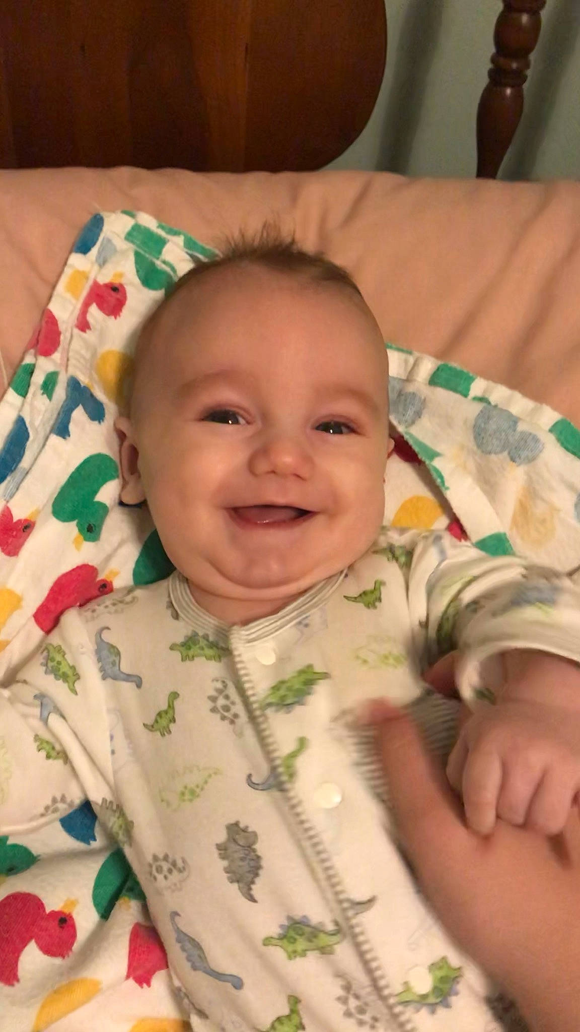 Moses is registered to the contest to win money with this photo: baby, baby_laughing, baby_products, baby_toddler_clothing, cheek, child, eye, facial_expression, finger, home_accessories, joy, laugh, linens, mouth, nose, person, skin, sleeve, smile, textile