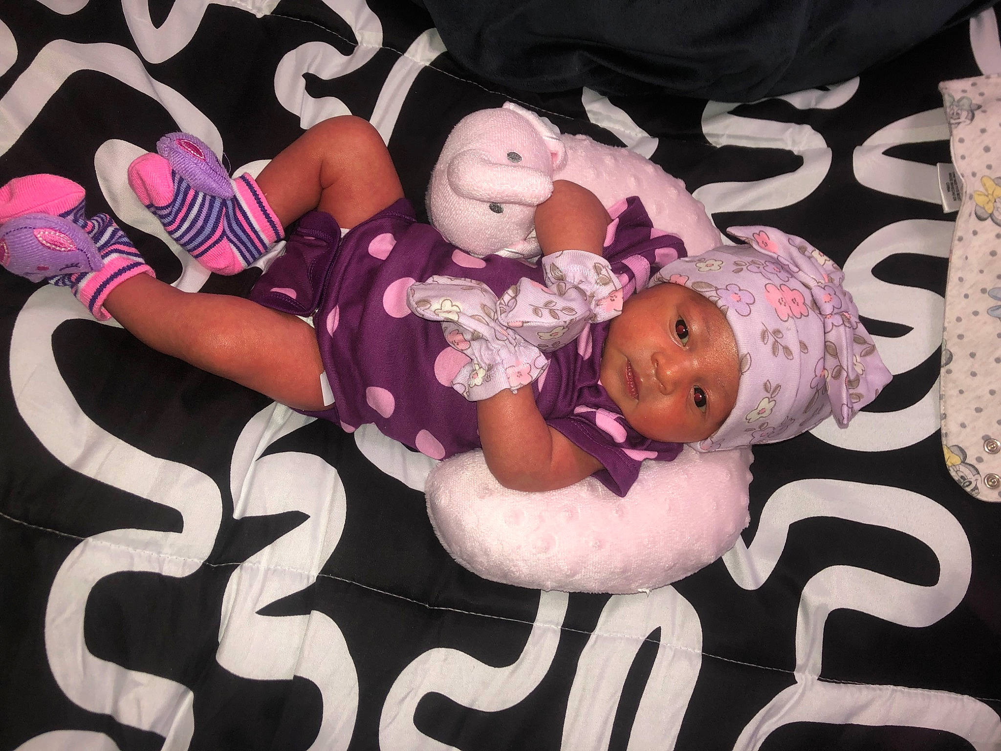 Khaleesi is registered to the contest to win money with this photo: art, baby, baby_products, baby_toddler_clothing, child, comfort, event, facial_expression, font, happy, headgear, headwear, linens, pattern, person, pink, product, room, sleeve, textile