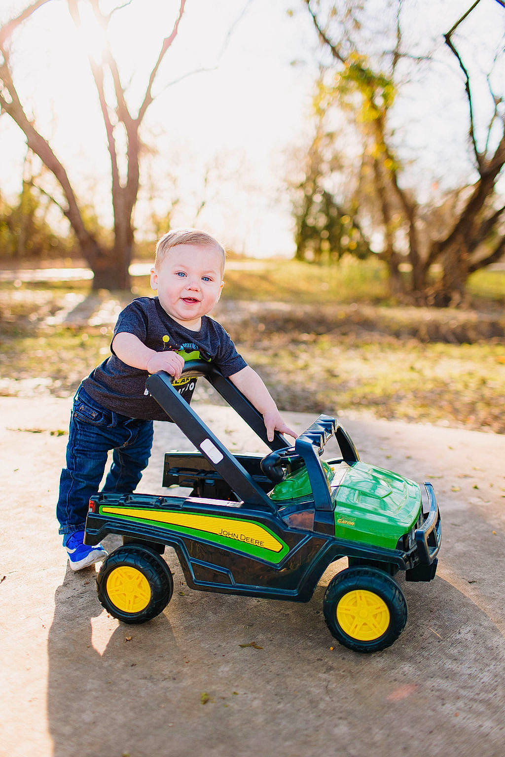 Malakai joined the competition — help win amazing prizes! automotive_tire, automotive_wheel_system, baby, child, grass, happy, leisure, people_in_nature, person, plant, recreation, riding_toy, rolling, sky, soil, tire, toddler, tree, vehicle, wheel