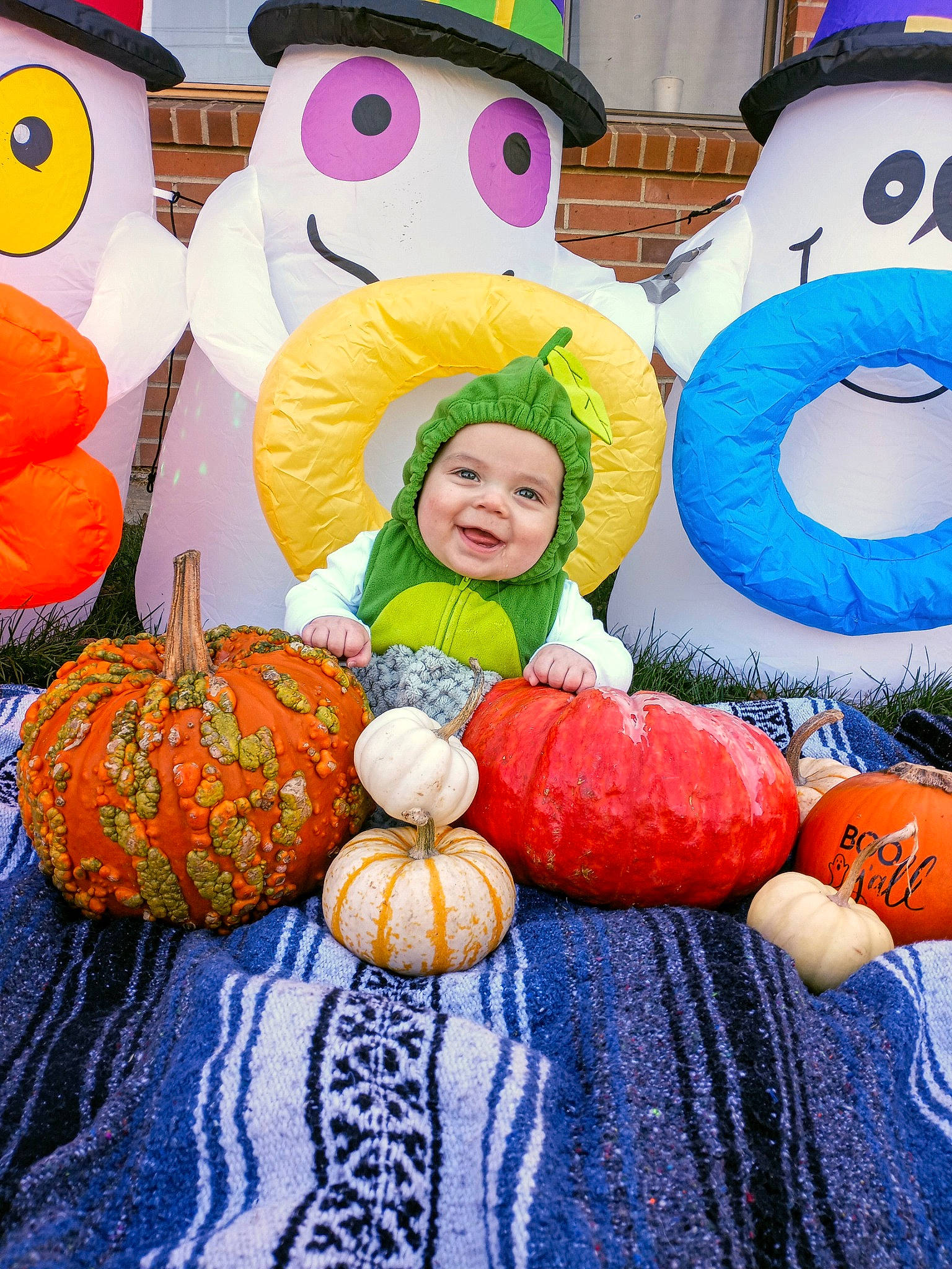 Callen is registered to the contest to win money with this photo: blue, calabaza, child, cucurbita, event, facial_expression, fun, gourd, happy, headwear, joy, local_food, natural_foods, orange, person, plant, pumpkin, smile, squash, tradition