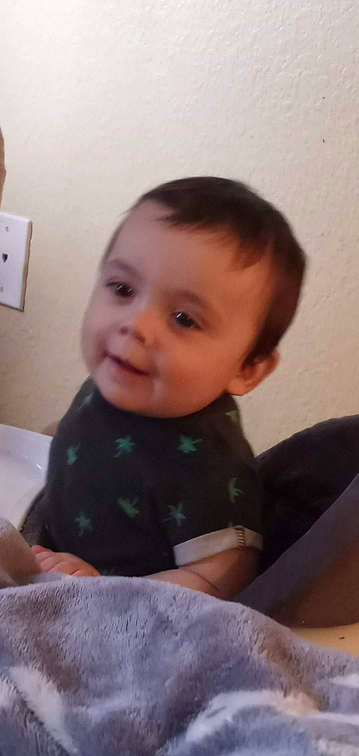 Callen is registered to the contest to win money with this photo: baby, baby_toddler_clothing, cheek, comfort, eye, eyebrow, finger, forehead, hair, hairstyle, head, iris, lip, mouth, neck, nose, person, skin, sleeve, thumb