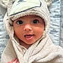 baby, child, towel, hooded_towel, face, eyes, mouth, tongue, hand, skin, fabric, cute, infant, wrapped, soft, plush, background, clouds, pattern, adorable