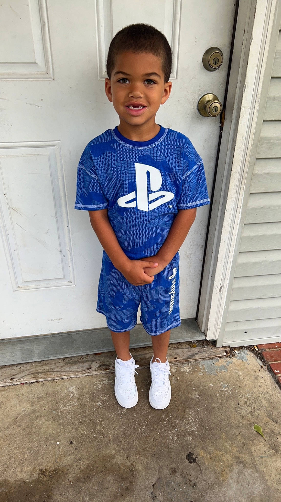 Ronny joined the competition — help win amazing prizes! baby_toddler_clothing, denim, door, electric_blue, eye, footwear, hairstyle, happy, joy, knee, neck, person, shoe, shoulder, sleeve, smile, sportswear, standing, t_shirt, thigh