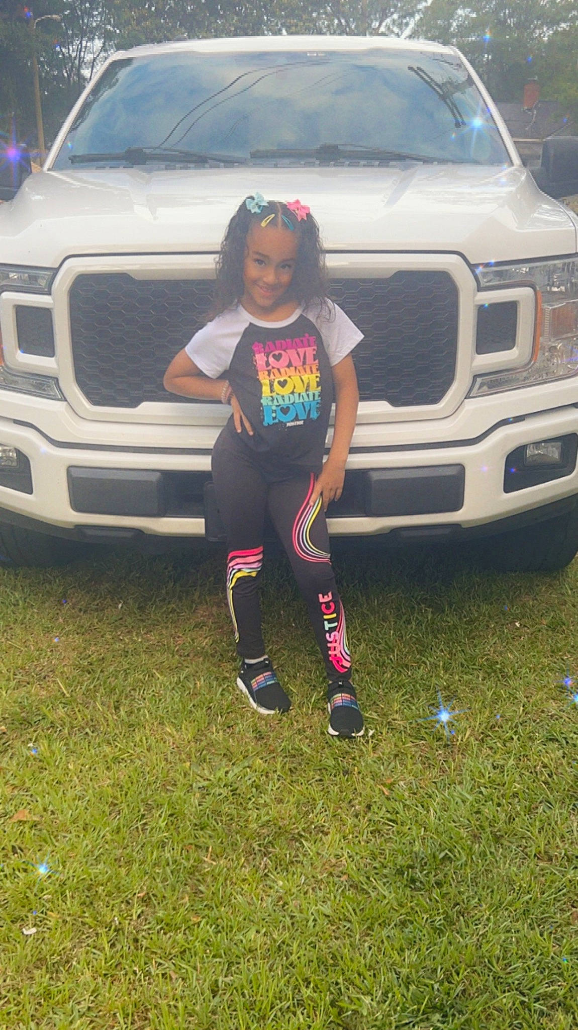 Justice joined the competition — help win amazing prizes! automotive_design, automotive_exterior, automotive_lighting, automotive_tire, bumper, car, clothing, grille, hood, jeans, joy, land_vehicle, light, mammal, motor_vehicle, person, pink, shorts, tire, vehicle