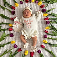 Melody joined the competition — help win amazing prizes! baby, infant, sleeping, tulips, flowers, blanket, white_clothing, headband, sign, month_marker, colorful, nature, floral_arrangement, cute, newborn, soft_texture, peaceful, indoors, baby_accessories, portrait