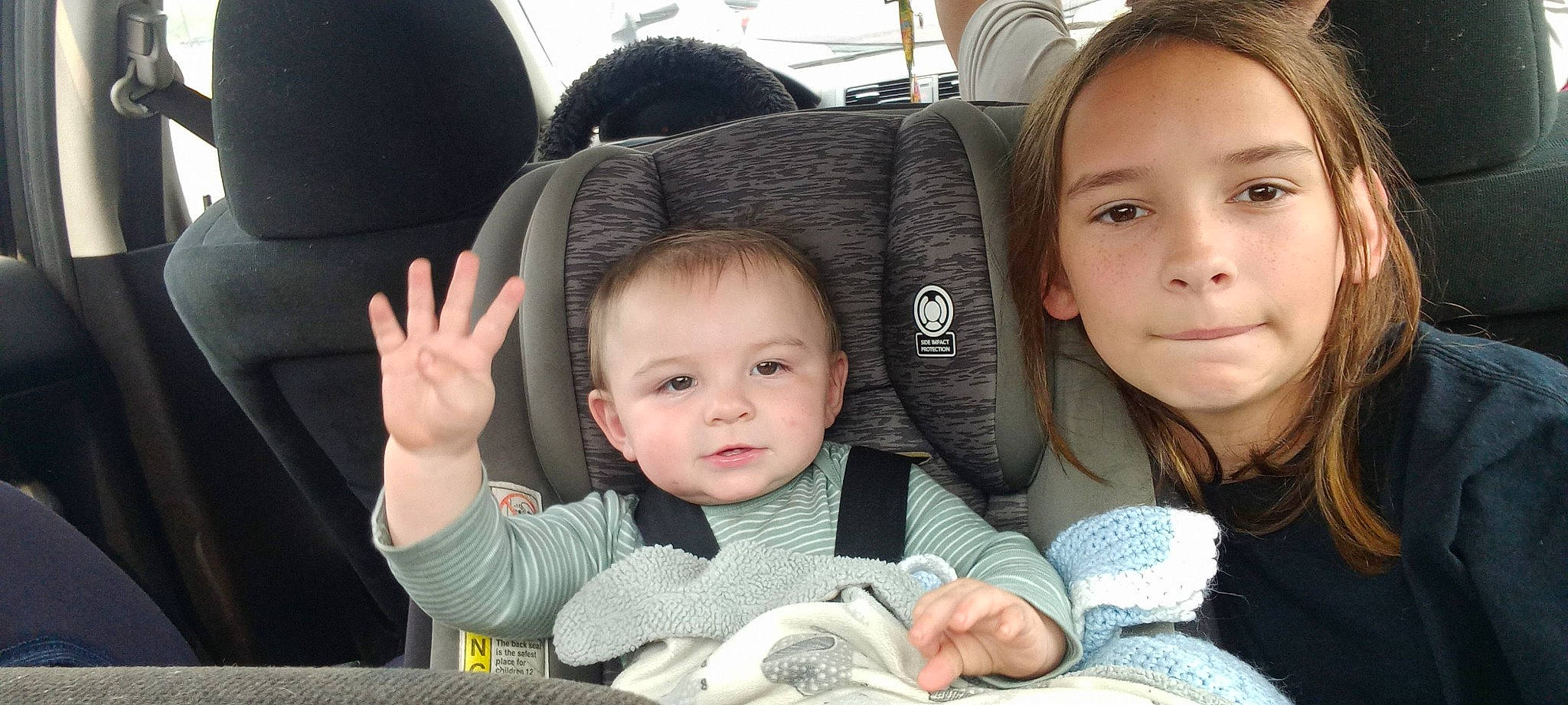 Taylor is registered to the contest to win money with this photo: auto_part, baby, baby_in_car_seat, baby_products, baby_toddler_clothing, car_seat, cheek, child, comfort, finger, gesture, happy, motor_vehicle, person, product, seat_belt, sitting, skin, smile, thumb