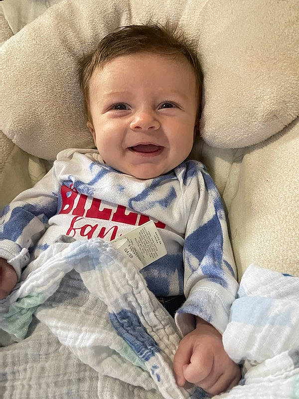 Kamden is registered to the contest to win money with this photo: baby, baby_toddler_clothing, cheek, child, chin, comfort, finger, gesture, happy, iris, linens, mammal, nose, outerwear, person, skin, sleeve, smile, textile, toddler