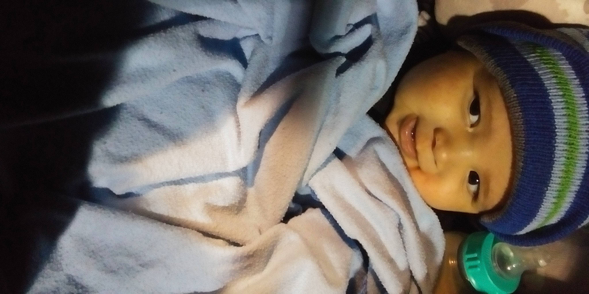 Raymond is registered to the contest to win money with this photo: baby, baby_carriage, baby_products, baby_toddler_clothing, cheek, child, comfort, eyebrow, eyelash, face, fur, happy, headwear, linens, nose, person, portrait_photography, sitting, sleep, smile