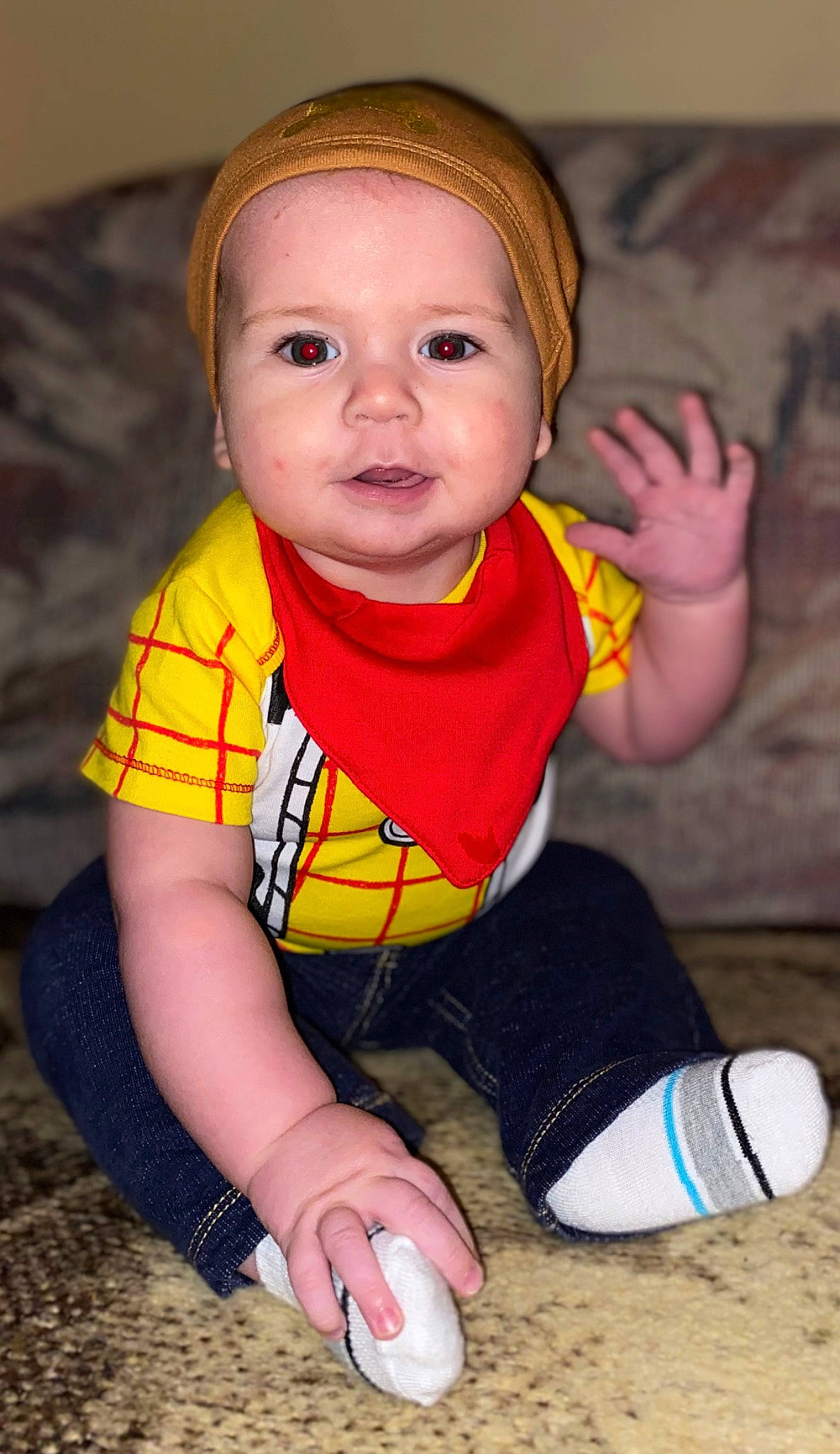 Kolby is registered to the contest to win money with this photo: arm, baby, baby_toddler_clothing, cheek, child, eye, face, finger, flooring, fun, happy, joint, neck, nose, person, personal_protective_equipment, sitting, skin, sleeve, t_shirt