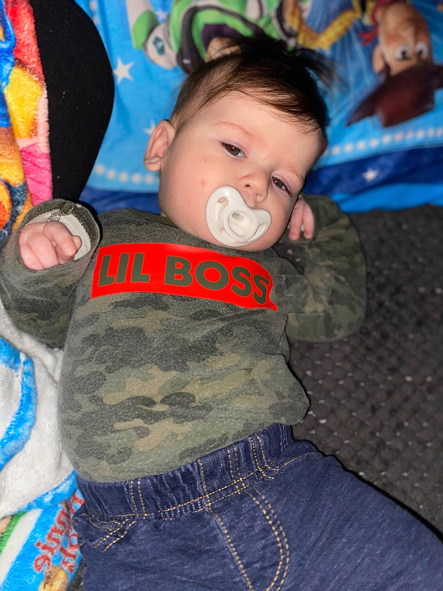 Kolby is registered to the contest to win money with this photo: baby, baby_products, baby_toddler_clothing, cheek, child, comfort, electric_blue, fun, happy, linens, pattern, people, person, play, sleeve, t_shirt, toddler