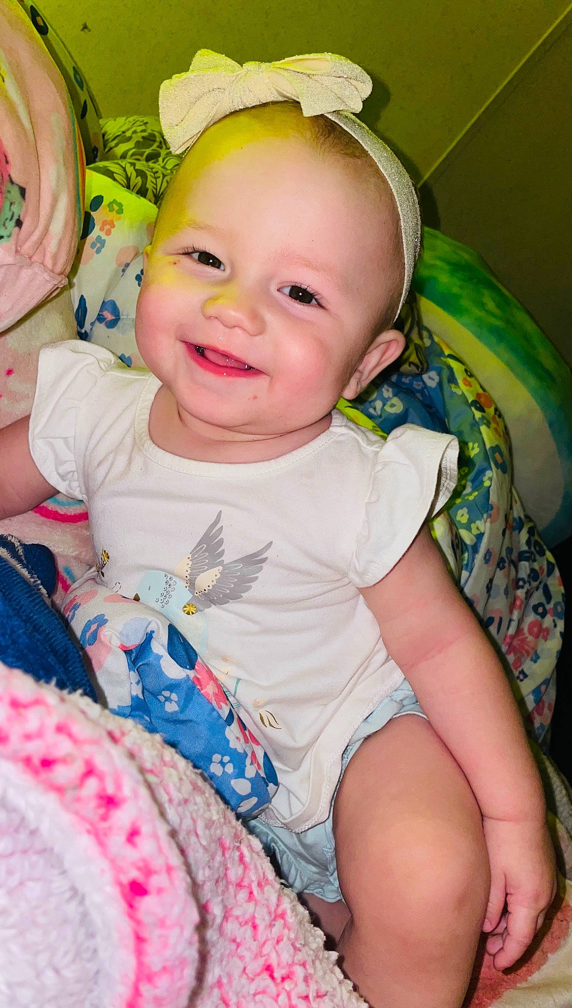 Irissa joined the competition — help win amazing prizes! baby, baby_toddler_clothing, beauty, cheek, child, comfort, eye, facial_expression, fun, green, happy, iris, joy, person, pink, product, purple, sitting, skin, smile