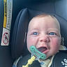 Anthony joined the competition — help win amazing prizes! baby, infant, child, car_seat, pacifier, teether, toy, star_toy, blue_eyes, smiling, portrait, close_up, vehicle, safety, harness, infant_clothing, knitwear, seated, indoor, photograph