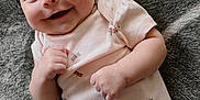 Amaya joined the competition — help win amazing prizes! baby, smiling, headband, pink_onesie, dragonfly_print, blanket, soft_texture, infant, happy, cute, portrait, lying_down, child, face, fist, skin, indoor, closeup, adorable, person