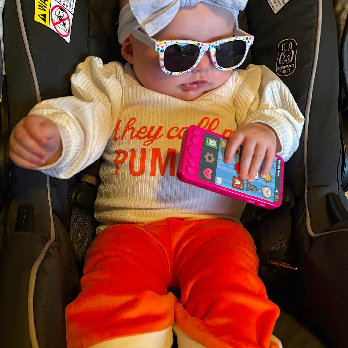 Amelya is registered to the contest to win money with this photo: accessories, baby, bodypart, clothing, couch, electronics, face, finger, furniture, glasses, hand, hat, head, knitwear, mobilephone, person, phone, photography, portrait, sunglasses