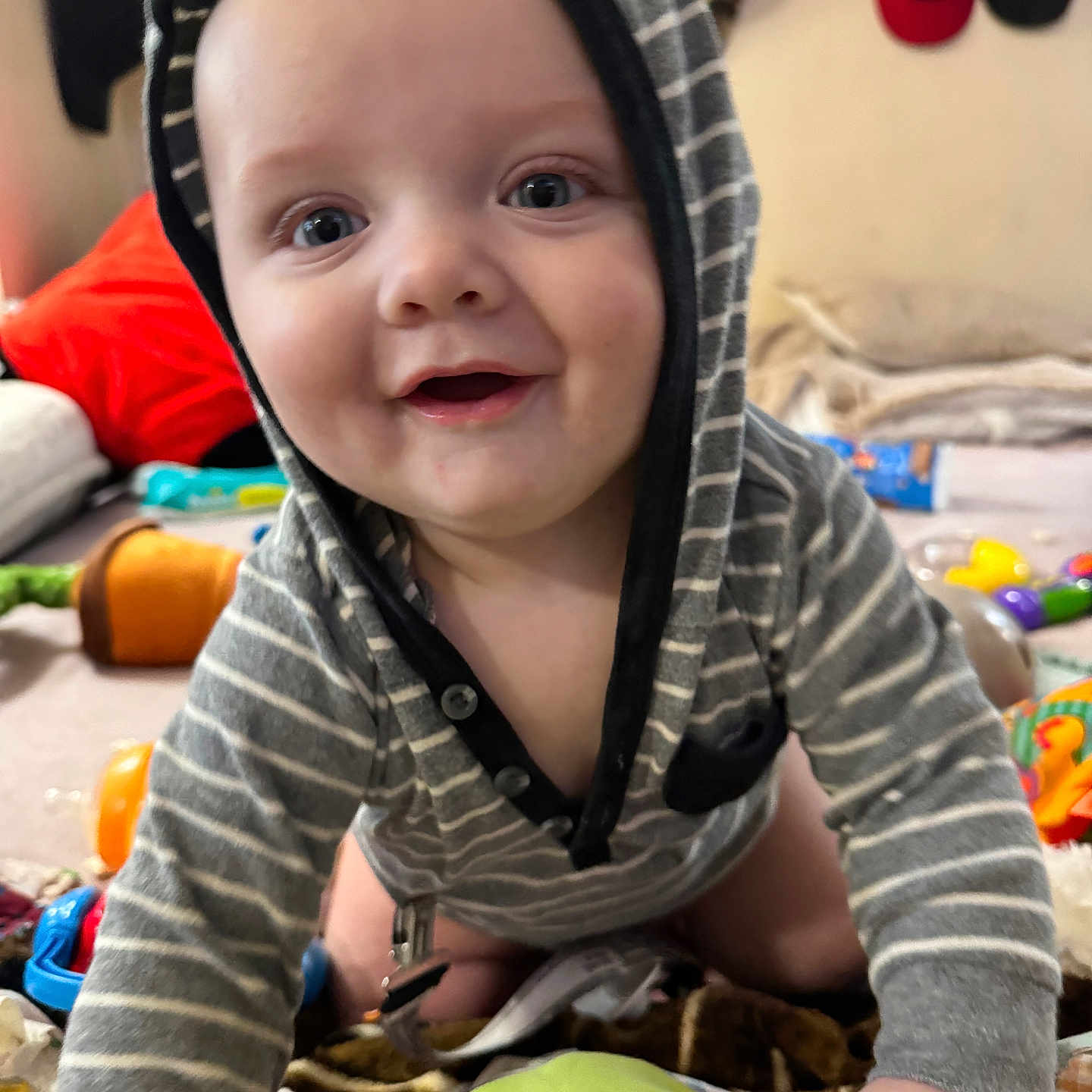 James is registered to the contest to win money with this photo: accessories, baby, bag, bodypart, bonnet, boy, child, clothing, crawling, face, handbag, happy, hat, head, hood, male, person, photography, portrait, smile