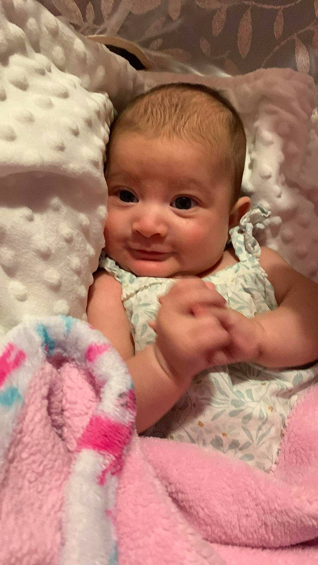 Catalina is registered to the contest to win money with this photo: baby, baby_toddler_clothing, cheek, child, comfort, eye, facial_expression, finger, gesture, happy, iris, mammal, mouth, nose, person, pink, product, skin, smile, toddler