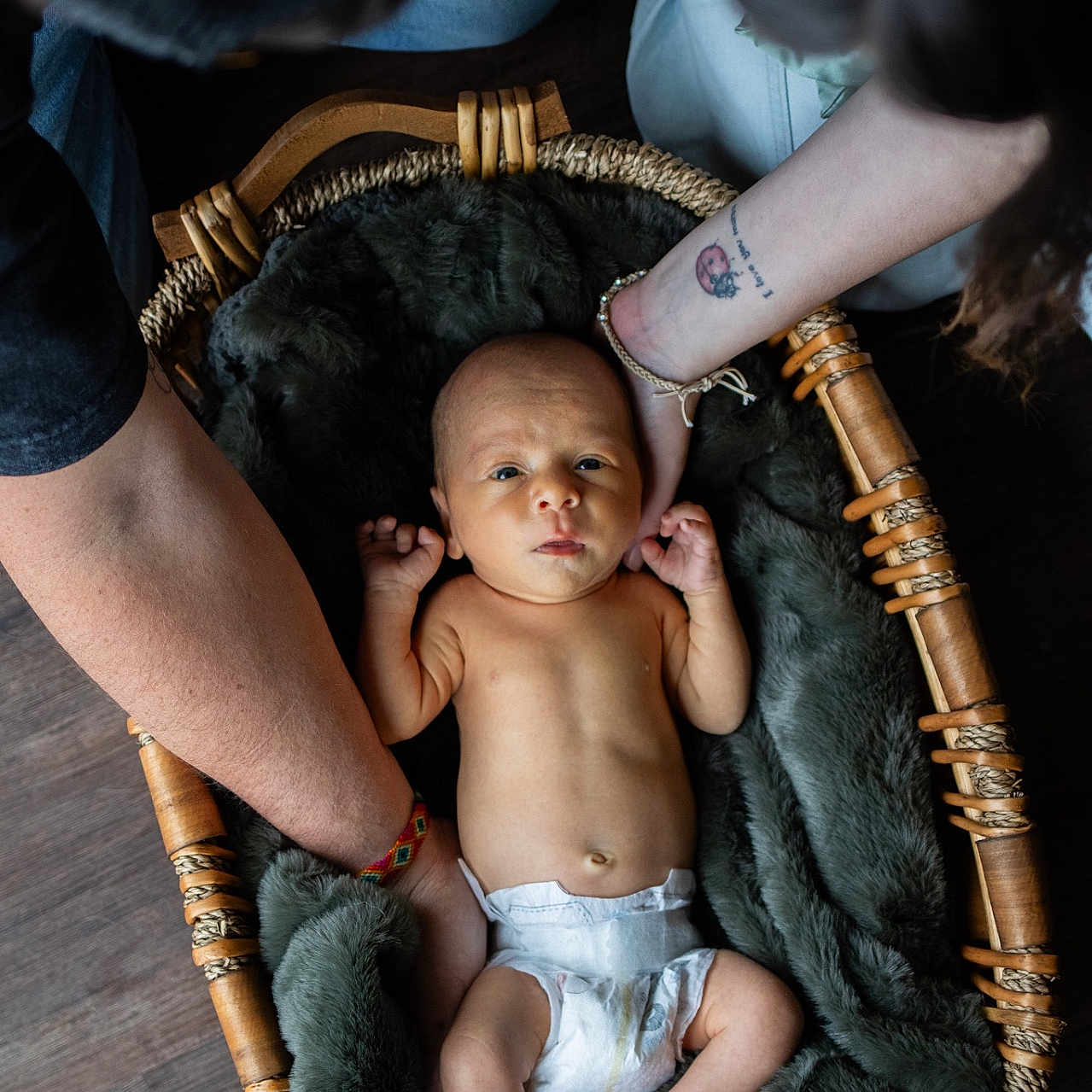 Sullivan is registered to the contest to win money with this photo: baby, basket, bed, bodypart, child, cradle, crib, diaper, face, female, finger, furniture, girl, hand, head, infantbed, newborn, person, photography, portrait
