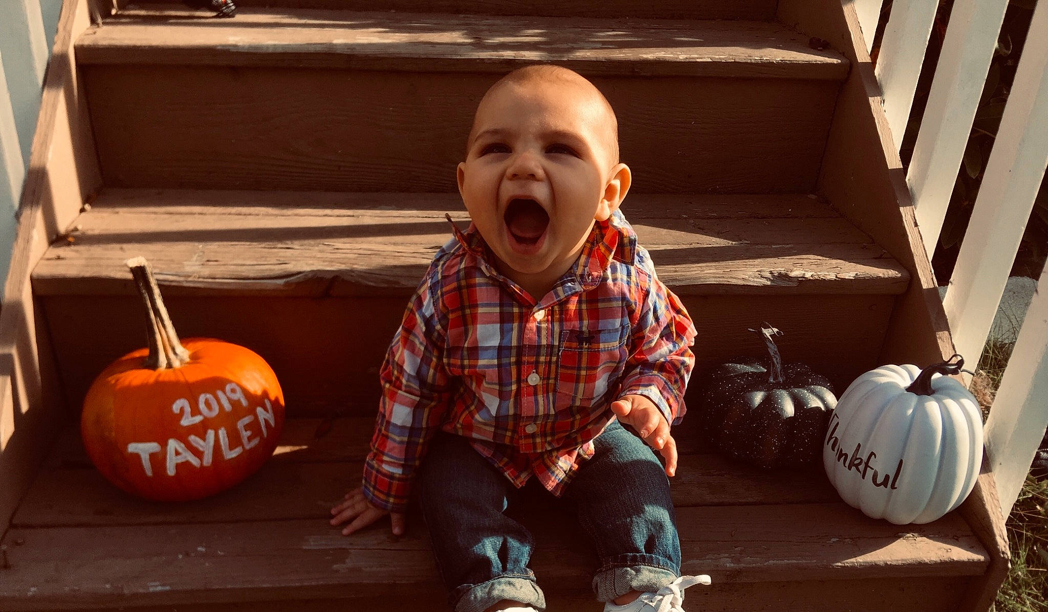 Taylen is registered to the contest to win money with this photo: baby, calabaza, cheek, child, cucurbita, face, facial_expression, food, fruit, gourd, head, orange, person, plant, pumpkin, smile, toddler, tooth, trick_or_treat, vegetable