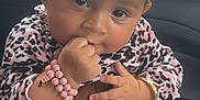 Janayla joined the competition — help win amazing prizes! baby, infant, child, pink_bow, headband, leopard_print, bracelet, hand, rings, car_interior, window, sitting, cute, curly_hair, portrait, skin, clothing, person, baby_clothes, fingers