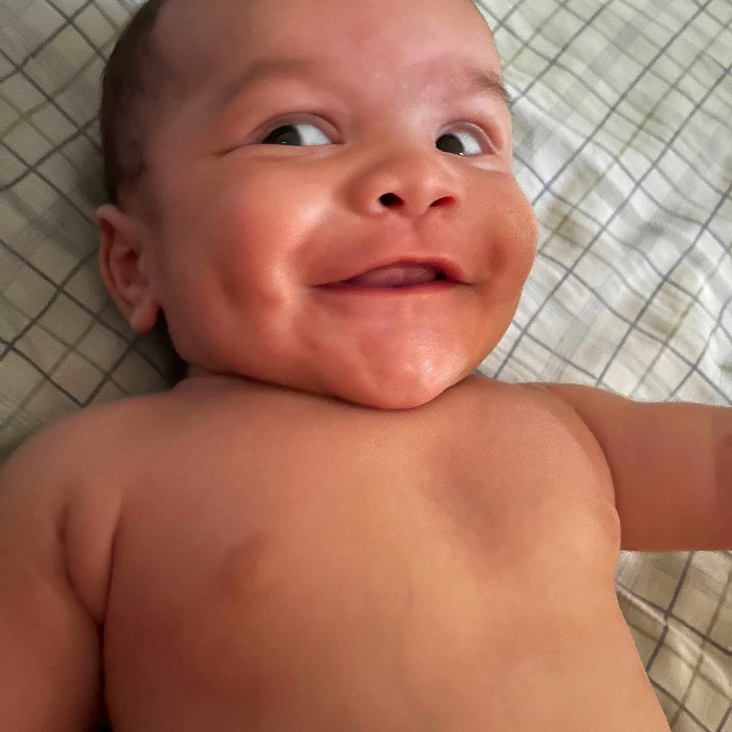 Zacari joined the competition — help win amazing prizes! baby, blanket, cheek, child, cute, dimples, expression, eyes, face, happy, head, human, indoors, infant, lying_down, mouth, pattern, shoulder, skin, smile