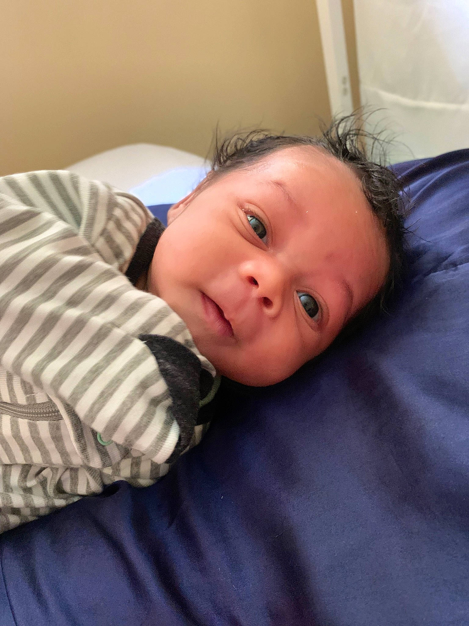 Raziel is registered to the contest to win money with this photo: baby_toddler_clothing, cheek, child, collar, comfort, eyebrow, flooring, happy, nose, pattern, person, sitting, skin, sleeve, smile, toddler, wood