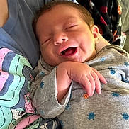 William joined the competition — help win amazing prizes! newborn, baby, infant, sleeping, yawning, smiling, face, hand, onesie, clothing, blanket, pattern, portrait, close_up, indoors, caregiver, lap, cozy, cute, photography
