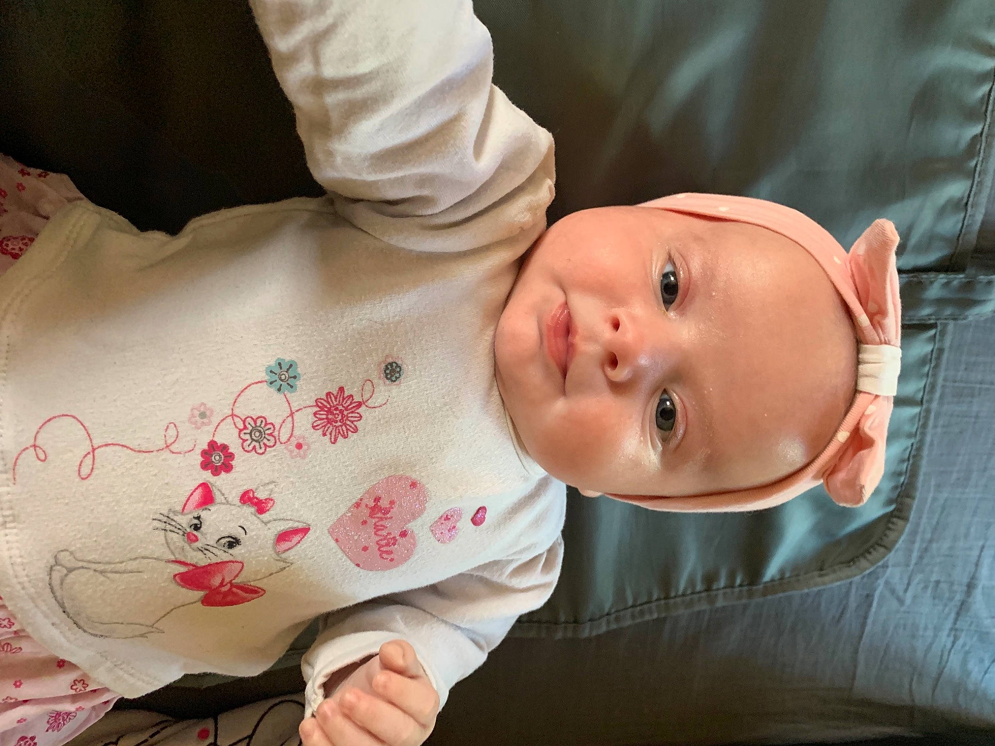 Giuliana participe au concours pour gagner de l'argent avec cette photo : baby, baby_products, baby_sleeping, baby_toddler_clothing, beauty, cheek, child, comfort, face, happy, hat, linens, lip, nose, pattern, person, petal, sitting, skin, sleeve