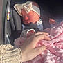 baby, sleeping, car_seat, headband, bow, blanket, pink, hand, knit_sweater, infant, peaceful, indoor, soft_texture, comfort, child, newborn, portrait, cute, warm, resting